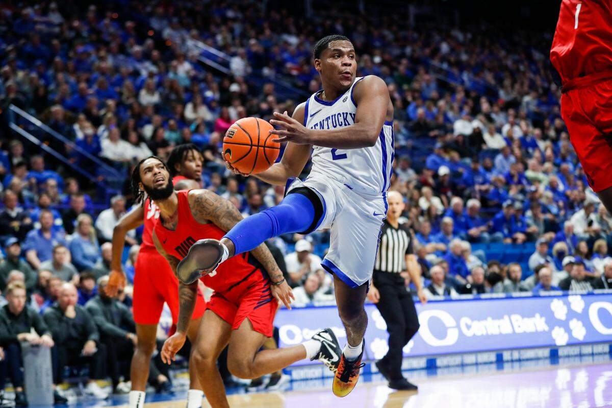 Kentucky guard Sahvir Wheeler (2) drives to the basket against Duquesne on Friday night. Wheeler produced 11 points and 11 assists off the bench in his season debut.