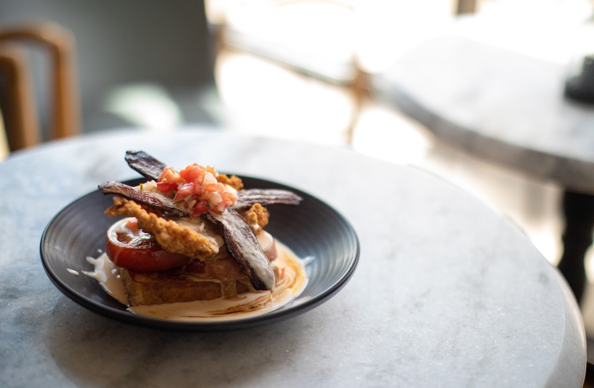 The 33 Staves take on the Hot Brown, served with fried chicken, candied bacon, fresh tomatoes and a house-made cheddar and fontina Mornay sauce.