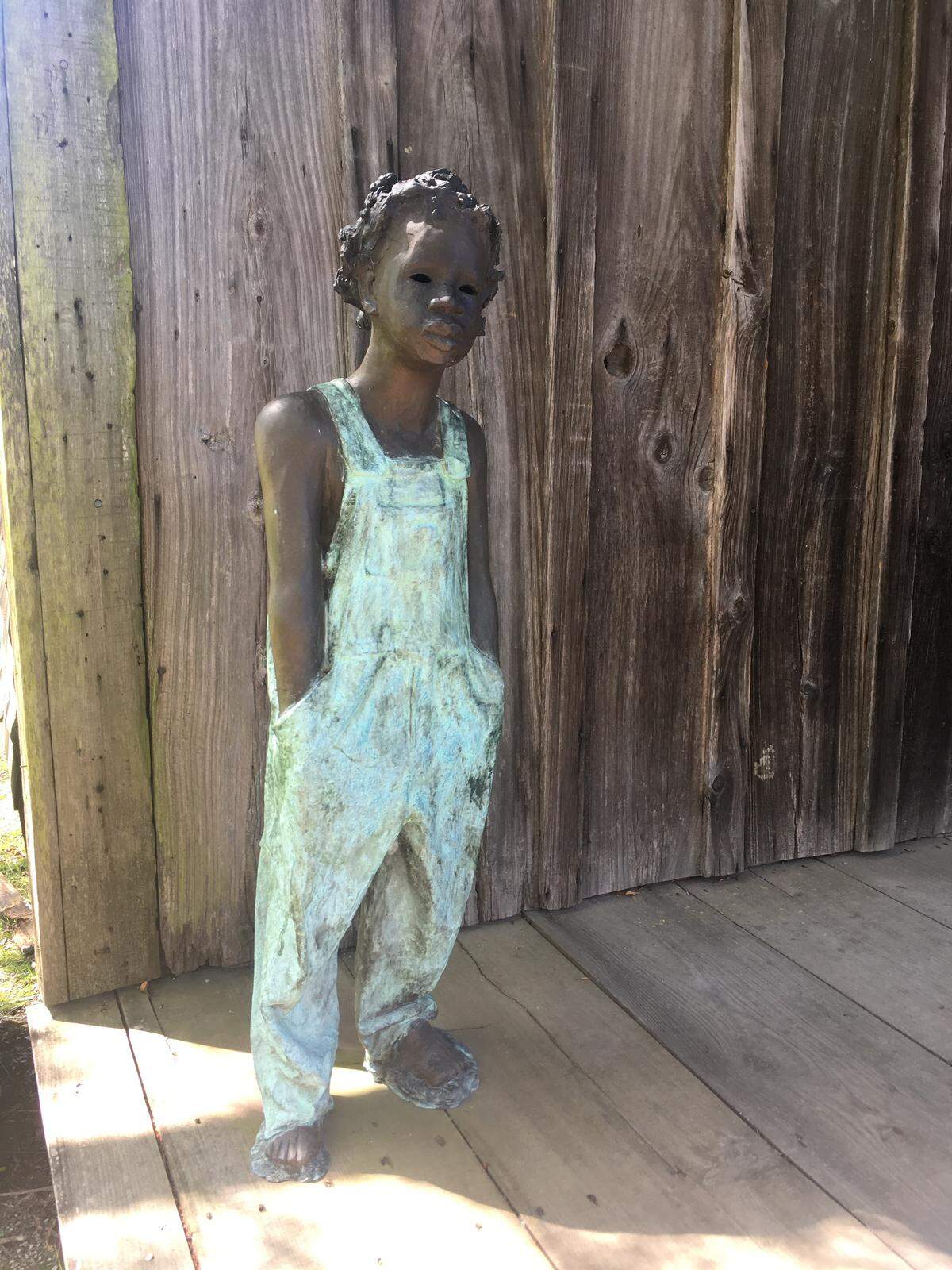 Statues of children, such as this one on a porch, are throughout the Whitney Plantation and remind visitors constantly of the humanity of those involved. Produced by artist Woodrow Nash. These pieces are based on interviews conducted in the 1930s by the Federal Writers’ Project of former slaves, who recalled their lives in slavery as children before Emancipation.