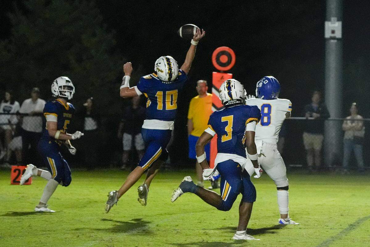 Sayre’s Gage Pennington deflects a pass intended for Kentucky Country Day’s Miles Bahe (8) on Friday night in Lexington. KCD won 31-28.