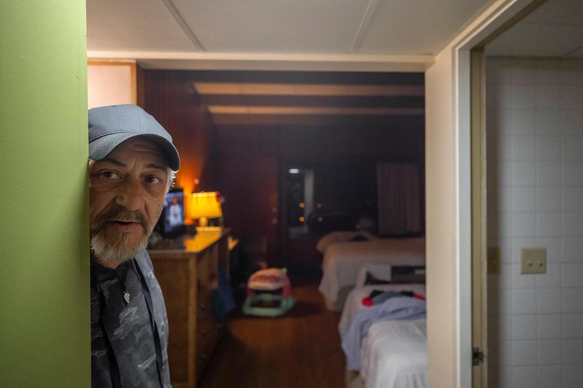 James Hall stands in his hotel room at Jenny Wiley State Resort Park in Prestonsburg, Ky., on Tuesday, Dec. 6, 2022. Hall said he lost nearly all his belonging’s in last summer’s floods.
