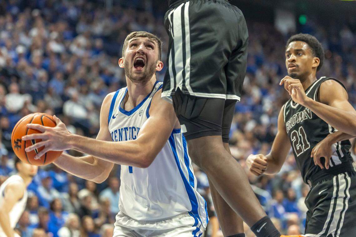 Kentucky’s Andrew Carr looks to shoot the ball as Brown’s N’famara Dabo defends during Tuesday’s game at Rupp Arena.