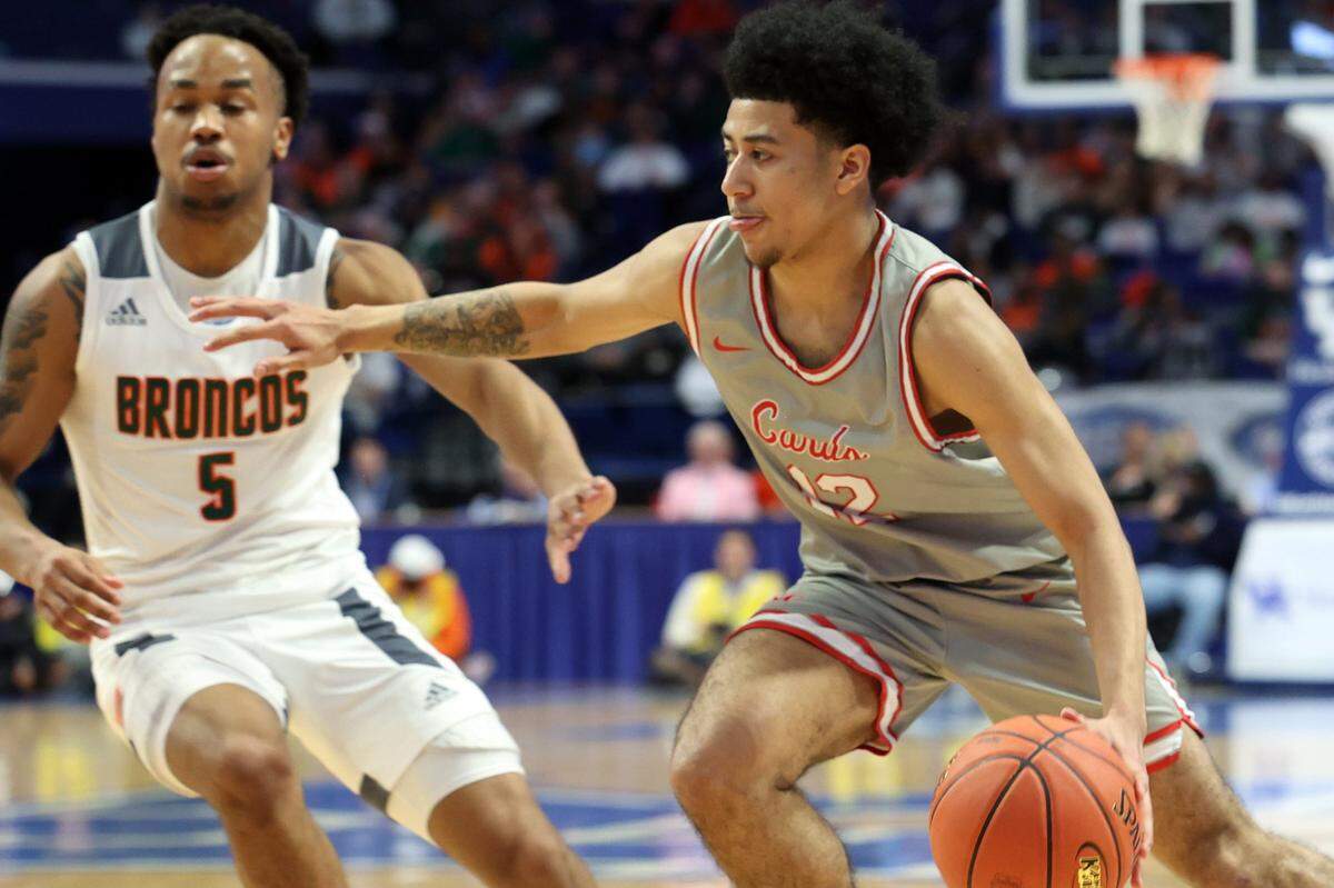 George Rogers Clark’s Samuel Parrish (12) drives near Frederick Douglass’ Tylon Webb (5) during the Sweet 16 semifinals at Rupp Arena on Saturday.