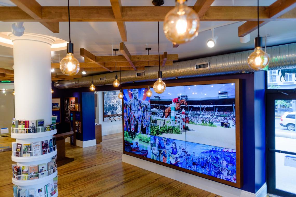 VisitLex's Visitors Center features a large nine-panel screen that displays Bluegrass attractions. The new visitors center opened June 1, 2018 on the ground floor of the renovated Fayette County courthouse.