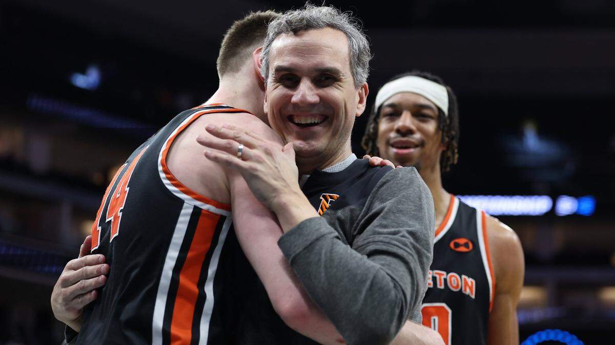 Mitch Henderson, head coach of No. 15 seed Princeton, celebrates Thursday’s victory against No. 2 seed Arizona.