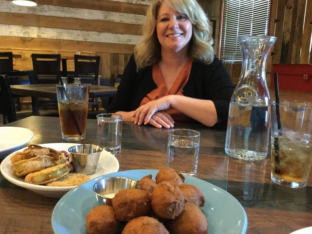 Jennifer “Mama” Lyles has a menu of Southern favorites including hush puppies and fried green tomatoes at Nash’s Southern Table and Bar.