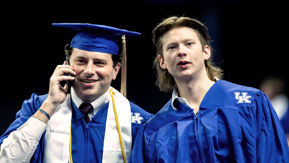 Two students guide family members into the arena during the first of two UK graduation ceremonies at Central Bank Center on May 9, 2025, in Lexington, Ky.