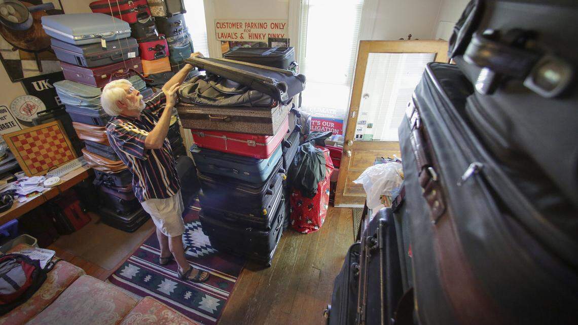 Don Pratt stands among the stacks of donated luggage he has received at his home in Lexington, Ky. on Tuesday, June 4, 2013. As he has been doing for the past 15 years, Pratt will distribute the luggage to state agencies for use by foster and adoptive children who need ways to carry and store their clothing and belongings.  Pratt said he has received more than 350 bags in the past week after an article was published in the Herald-Leader asking for donations. Photo by David Stephenson