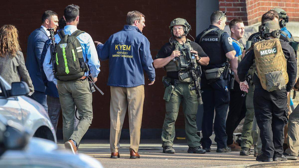 Kentucky Gov. Andy Beshear arrives at the scene of a shooting in Louisville, Ky., Monday, April 10, 2023. (Michael Clevenger/Courier Journal via AP)