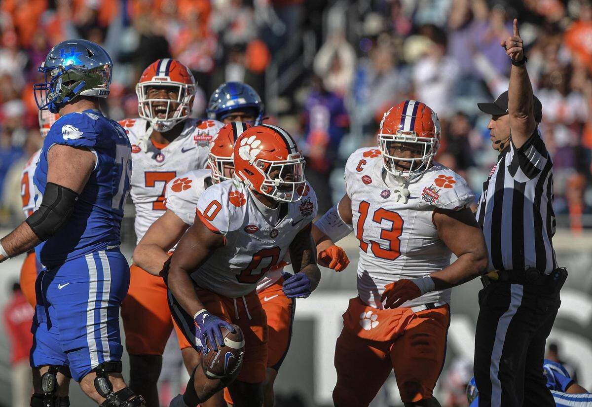 Clemson linebacker Barrett Carter recovers a fumble against Kentucky during the fourth quarter of the TaxSlayer Gator Bowl at EverBank Stadium in Jacksonville, Florida.