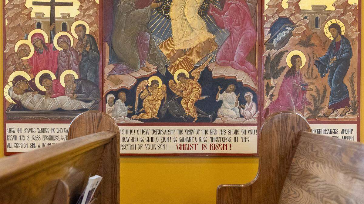 Three walls inside St. Andrew Orthodox Church are covered with floor-to-ceiling icons with gold-lead details painted by Ksenia Pokrovsky, a renowned modern iconographer who learned her craft in secret in the Soviet Union before immigrating to the United States. The icons include scenes from the lives of Christ, Mary, Orthodox feast days, and American Orthodox saints and inscriptions.