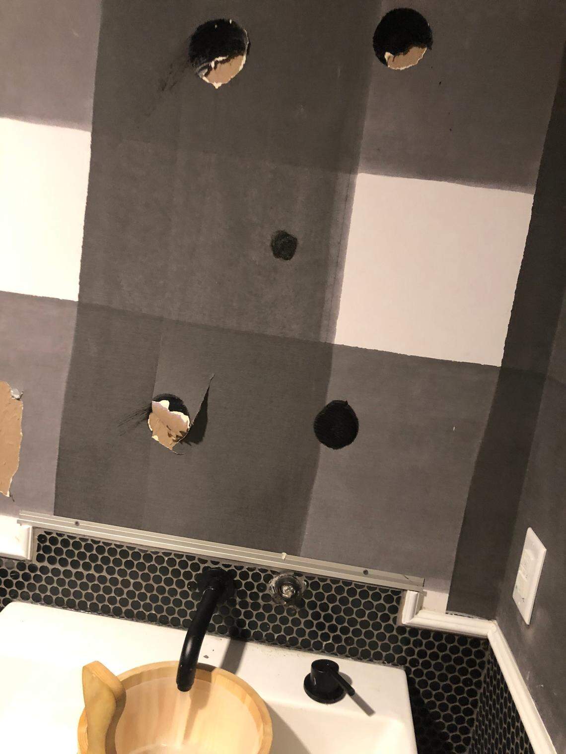 A bathroom in the exercise room of the Hub, an off-campus student apartment complex, on South Upper Street. The mirror has been ripped off the wall. A knob on the faucet came off the wall.
