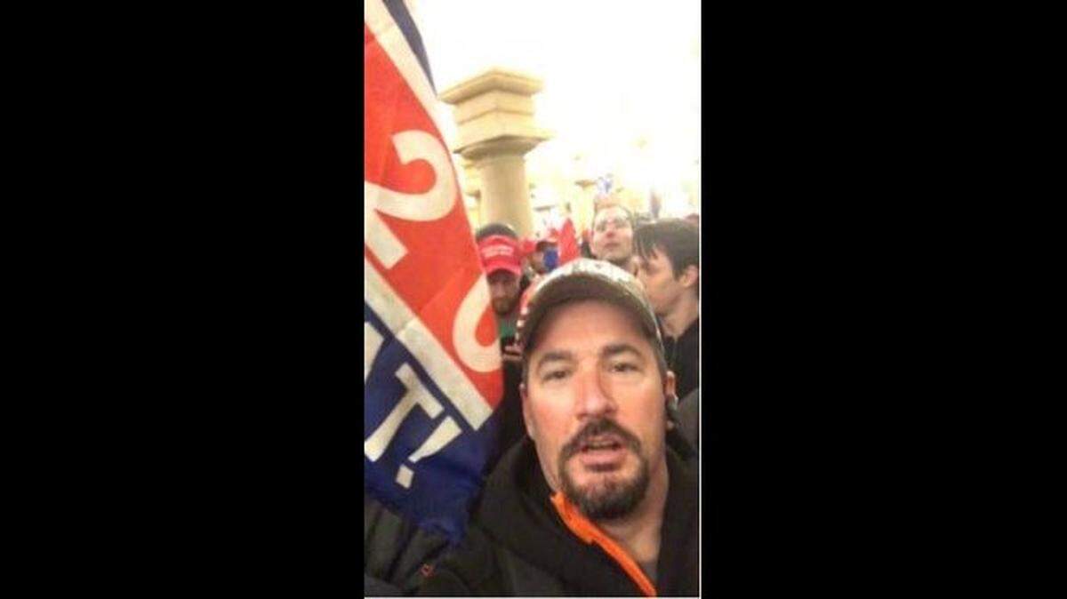 Robert Bauer, a Kentucky resident, was identified through photos of himself during the Capitol riot, according to the FBI. This photo was included in a criminal complaint filed against him.
