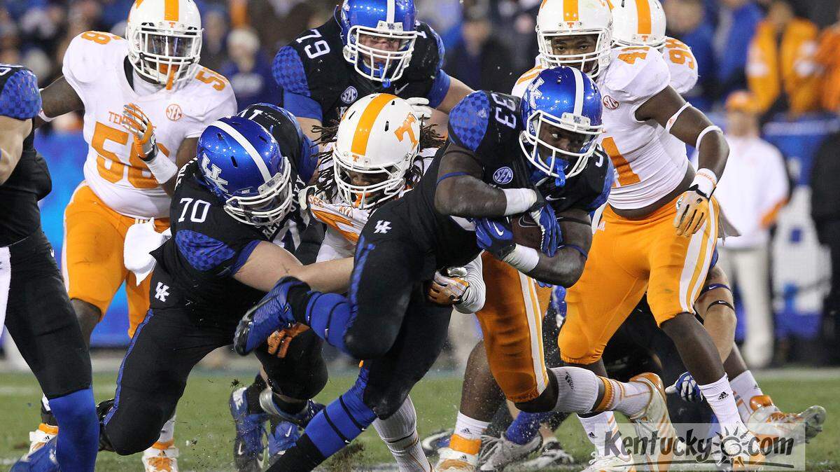 Kentucky Wildcats running back Dyshawn Mobley (33) breaks free for a first down against the Tennessee Volunteers during the first half at Commonwealth Stadium Saturday, Nov. 30, 2013 in Lexington, Ky. Photo by Amy Wallot