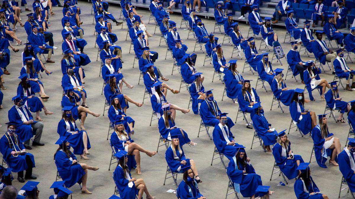 Graduates sit spaced out during the University of Kentucky commencement ceremony at Rupp Arena in Lexington, Ky., Sunday, May 16, 2021.