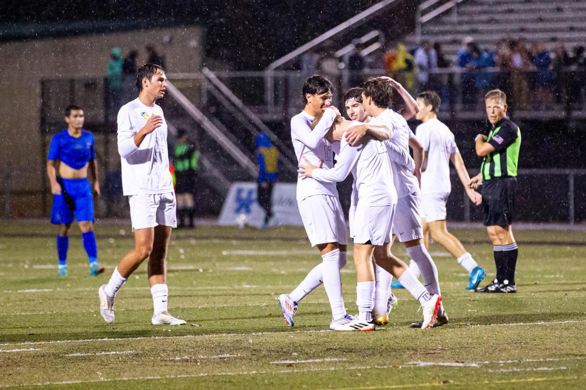 Henry Clay players celebrate a goal during Thursday night’s state semifinal match against Oneida Baptist at Paul Laurence Dunbar High School in Lexington. The Blue Devils will play for the state championship on Saturday night at Dunbar.