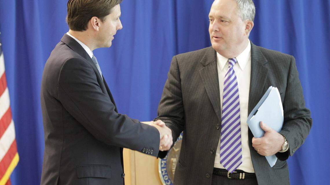 State Auditor Adam Edelen shook hands with Fayette schools  Superintendent Tom Shelton after Edelen's news conference Wednesday about his office's findings about the Lexington district.     