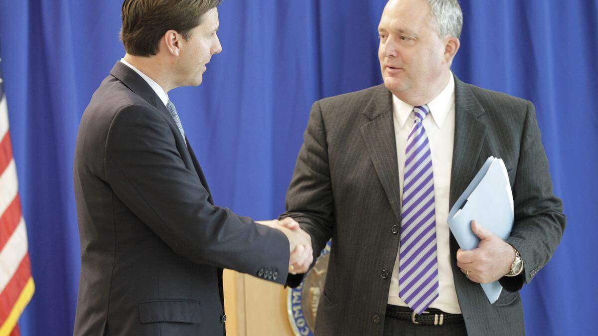 State Auditor Adam Edelen shook hands with Fayette schools  Superintendent Tom Shelton after Edelen's news conference Wednesday about his office's findings about the Lexington district.     