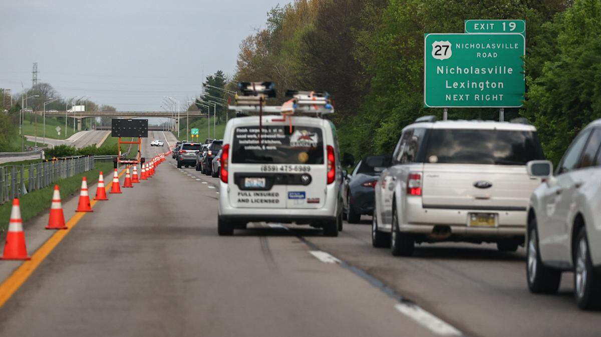 Police closed down part of New Circle Road to investigate a fatal collision on Monday, April 12, 2021. A woman was killed when she crashed while driving the wrong direction, ultimately hitting a police cruiser and injuring an officer, police say.