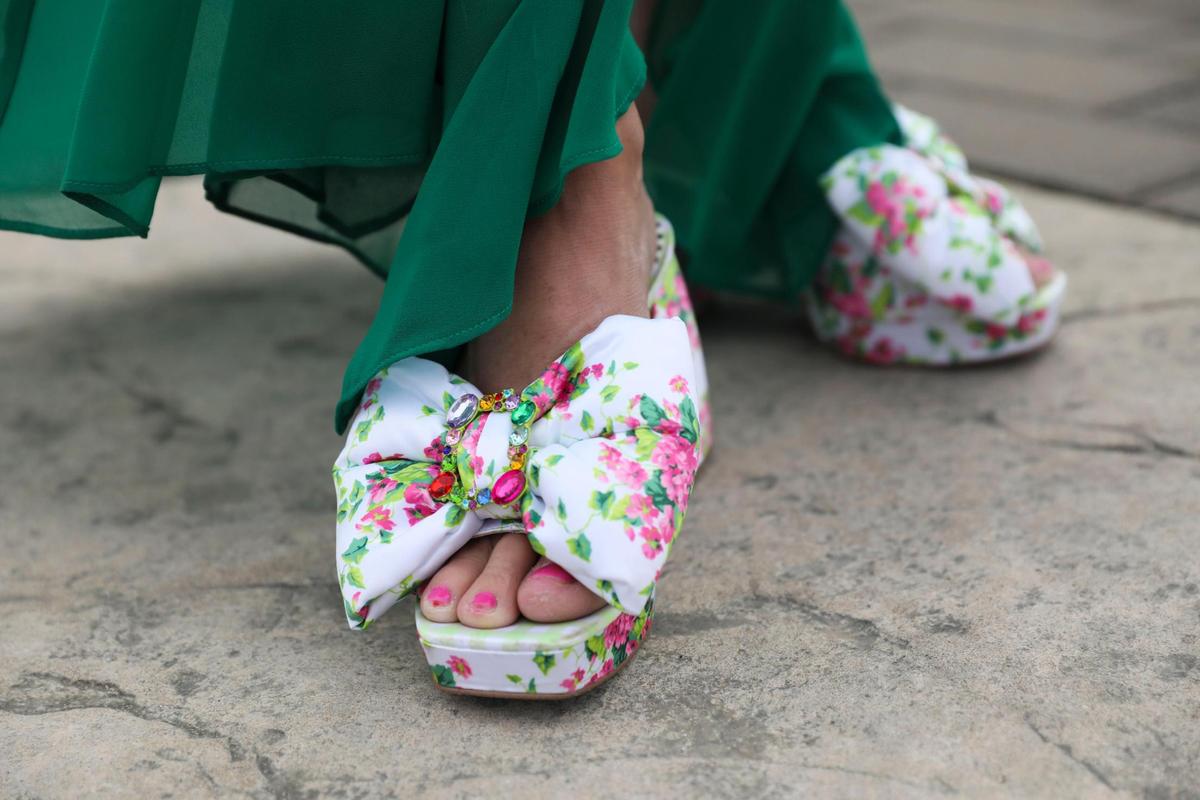 Carrie Blackwell wears floral heals by Betsey Johnson at Churchill Downs in Louisville, Ky., Saturday, May 6, 2023.