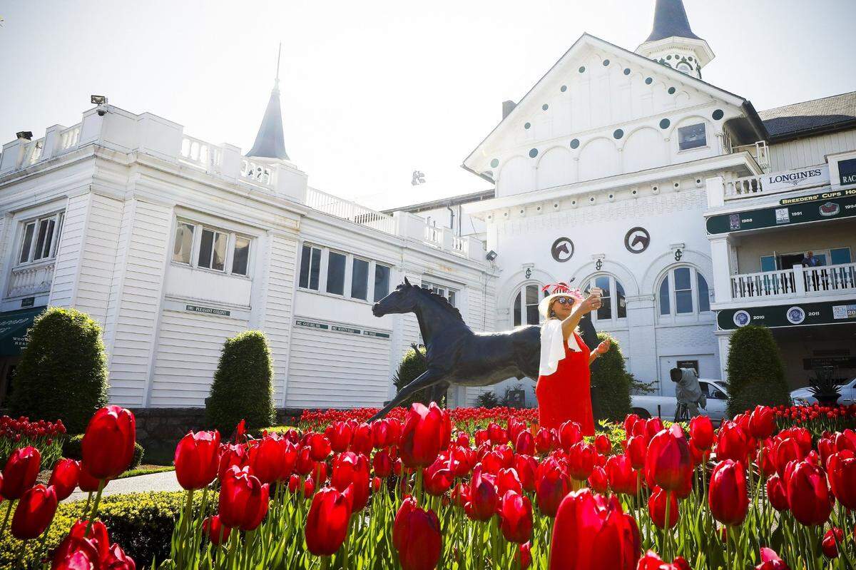 Wendy Hall of Louisville took a selfie with the Aristides statues at Churchill Downs. After two years of crowds limited because of the pandemic, the legendary racetrack expects its usual full house of some 150,000 or more fans for the race’s 148th running on May 7.