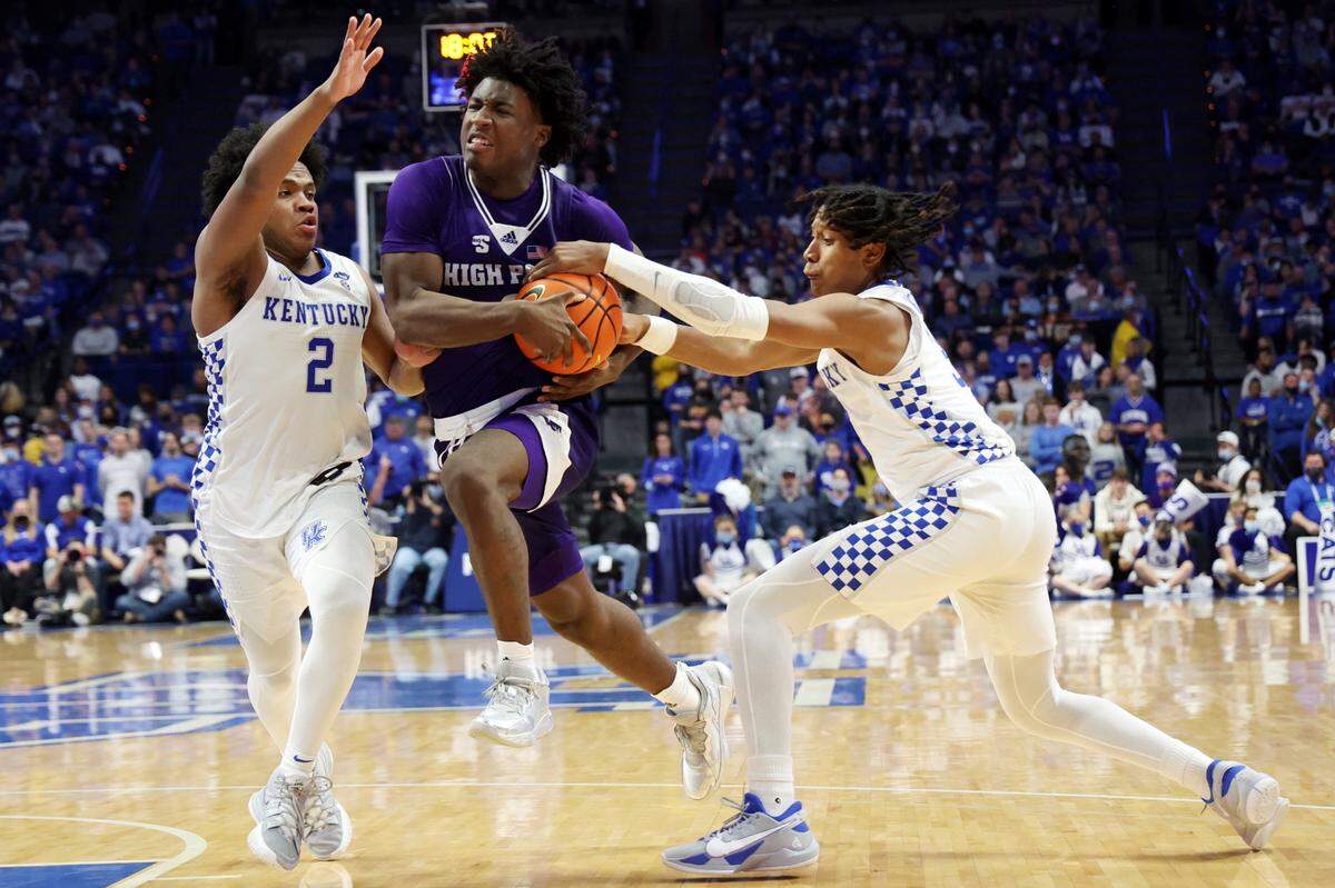 Kentucky’s Sahvir Wheeler, left, and TyTy Washington pressure High Point’s Jaden House during a UK win this season. The Wildcats’ starting backcourt duo finding consistency in the NCAA Tournament will be critical for UK to make a deep run.