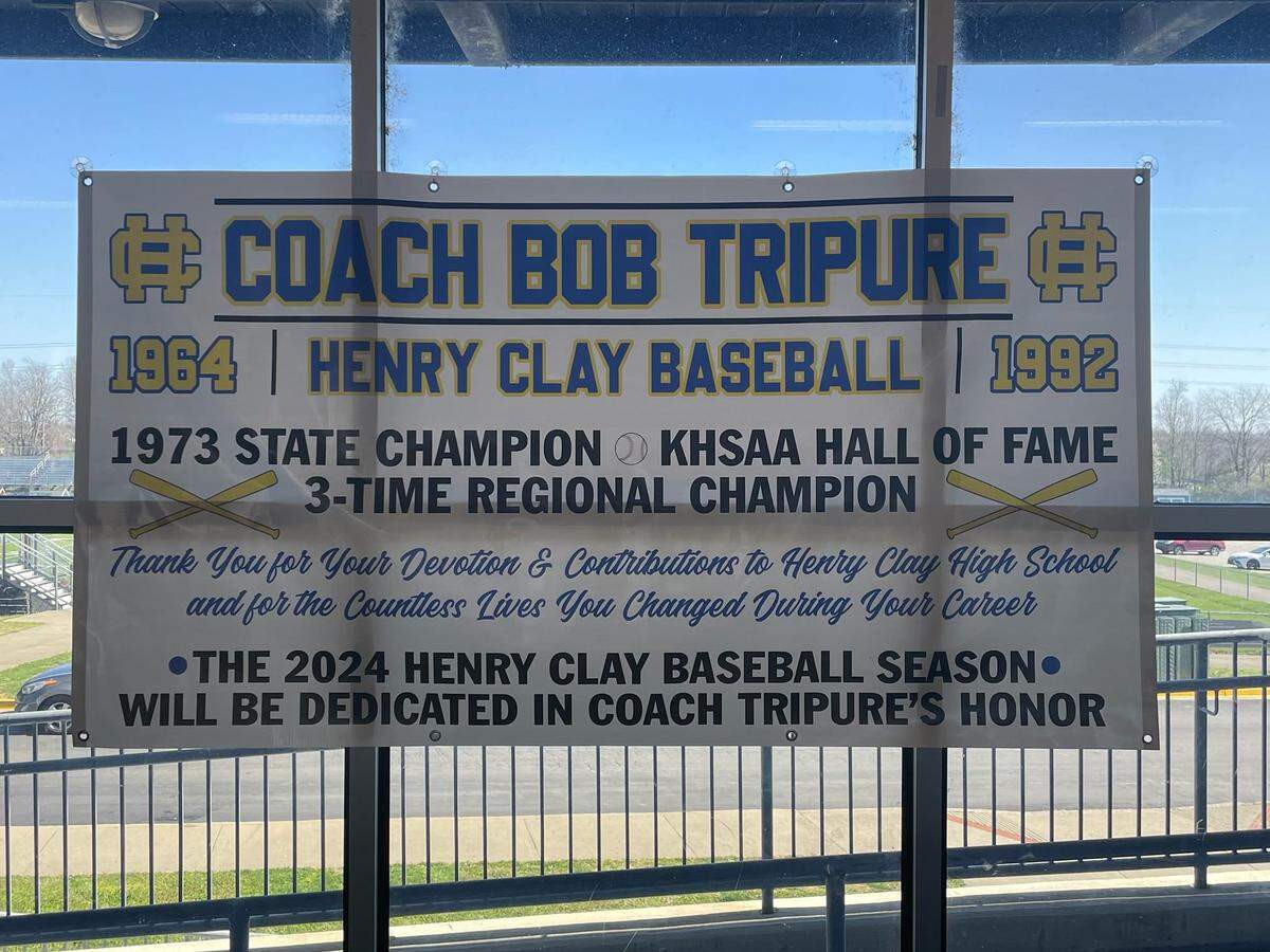The Henry Clay High School baseball team created a banner to signify it is playing the 2024 season in honor of Bob Tripure, the coach who led the Blue Devils to the 1973 state championship.