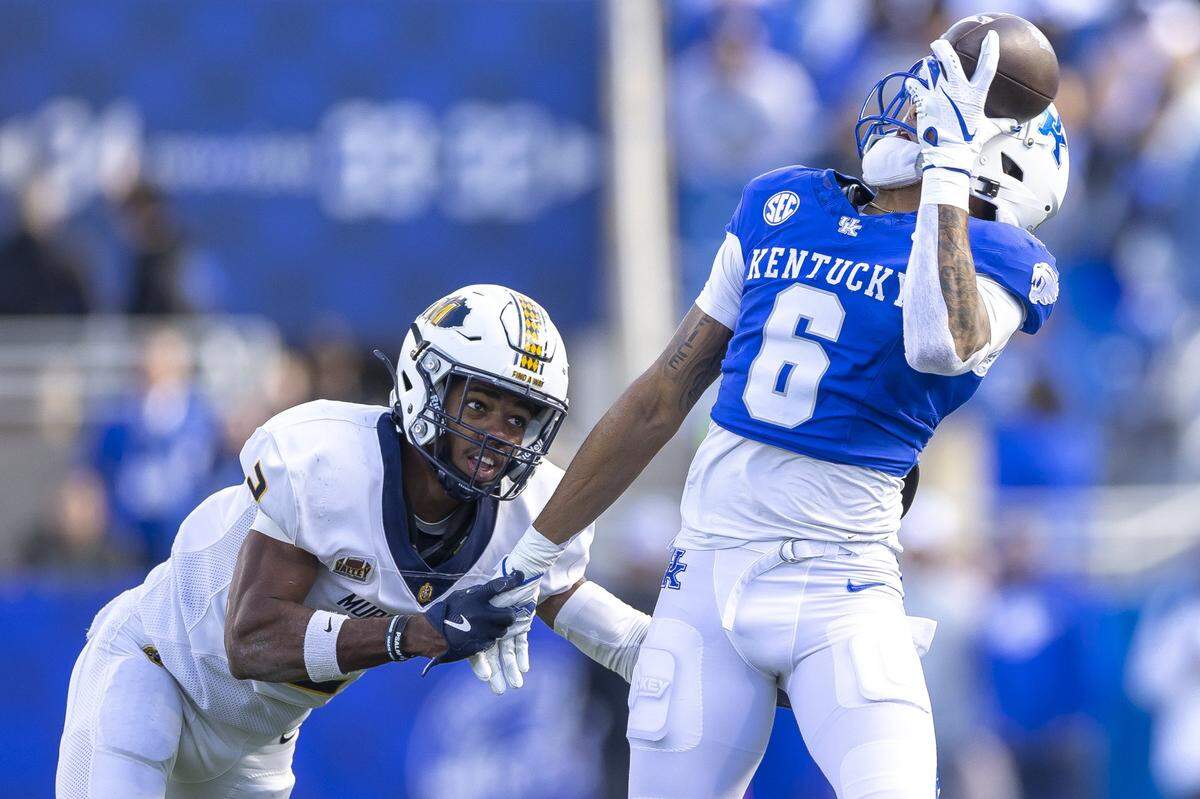 Kentucky wide receiver Dane Key (6) tries to bring in a catch in front of Murray State defensive back Larry Preston (2) during Saturday’s game at Kroger Field.