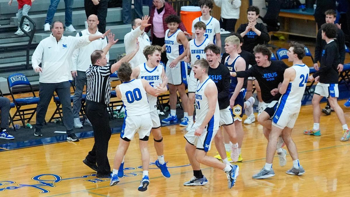 Lexington Catholic celebrated sophomore Jacob Holland’s last-second shot that helped the Knights defeat No. 9 Danville Christian 55-54 at Lexington Catholic High School on Tuesday.