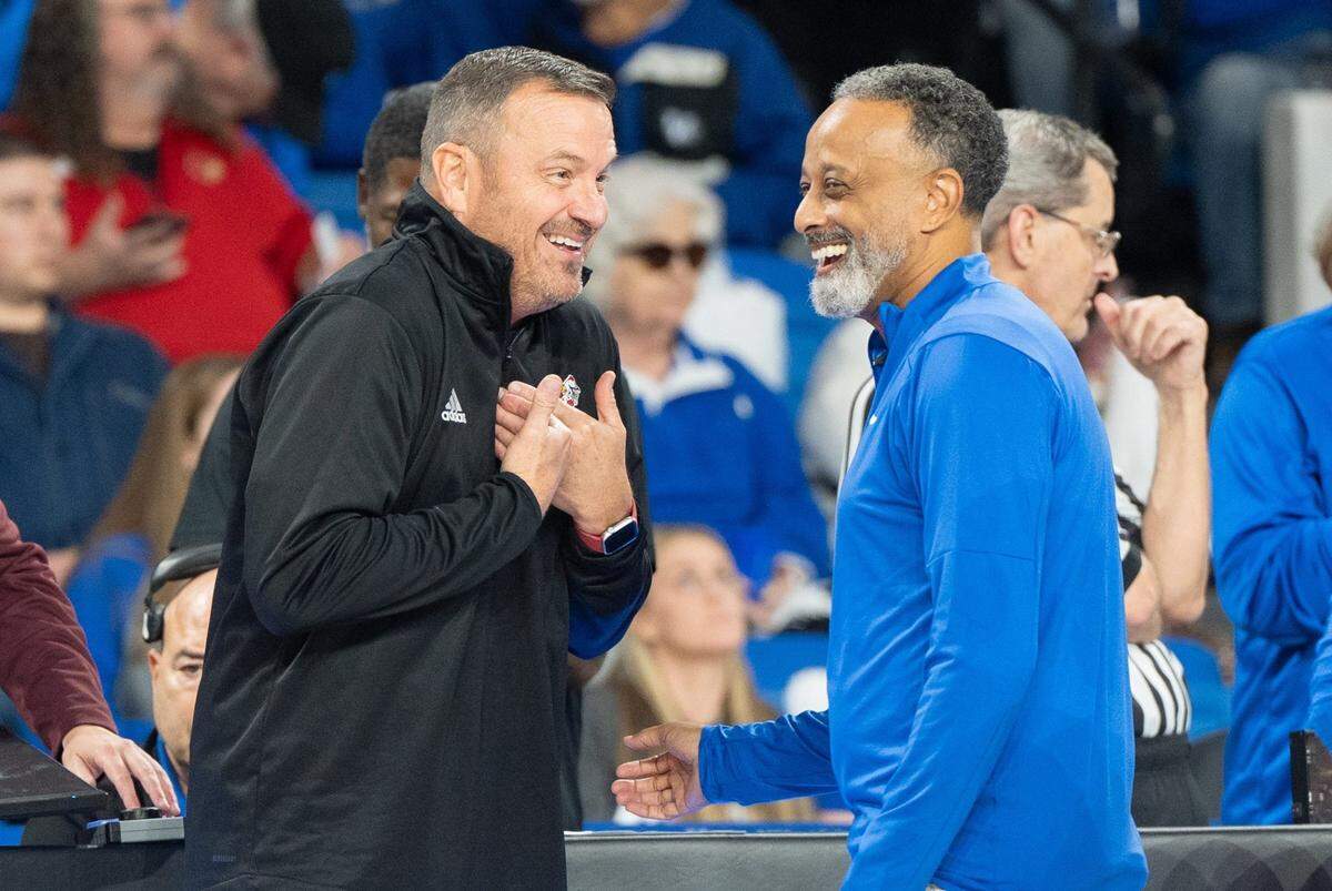 Louisville Cardinals head coach Jeff Walz talks to Kentucky Wildcats head coach Kenny Brooks ahead of their game on Saturday, Nov. 16, 2024 at Memorial Coliseum in Lexington, Ky.