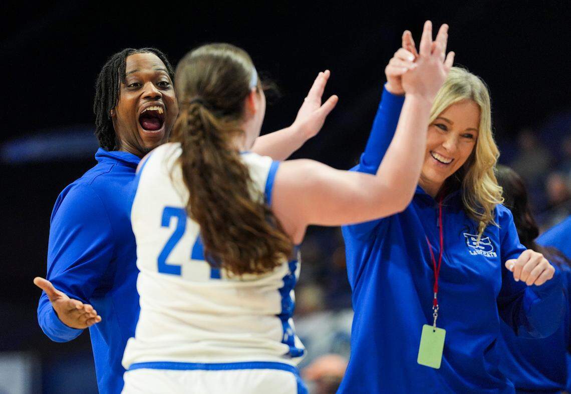 Franklin-Simpson's Allye Pennington is high-fived by her assistant coaches after she substitutes out of the game during the Clark’s Pump-N-Shop Girls’ Basketball Sweet 16 first round at Rupp Arena on Thursday.