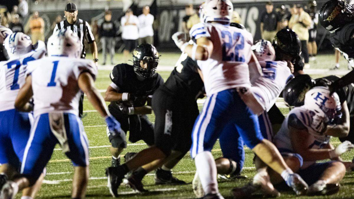 Boyle County’s Ji’Dyn Smith-Hisel tried to find a way through Highlands’ defense in the second half of the Rebels’ 21-20 win at Rebel Stadium in Danville on Friday.