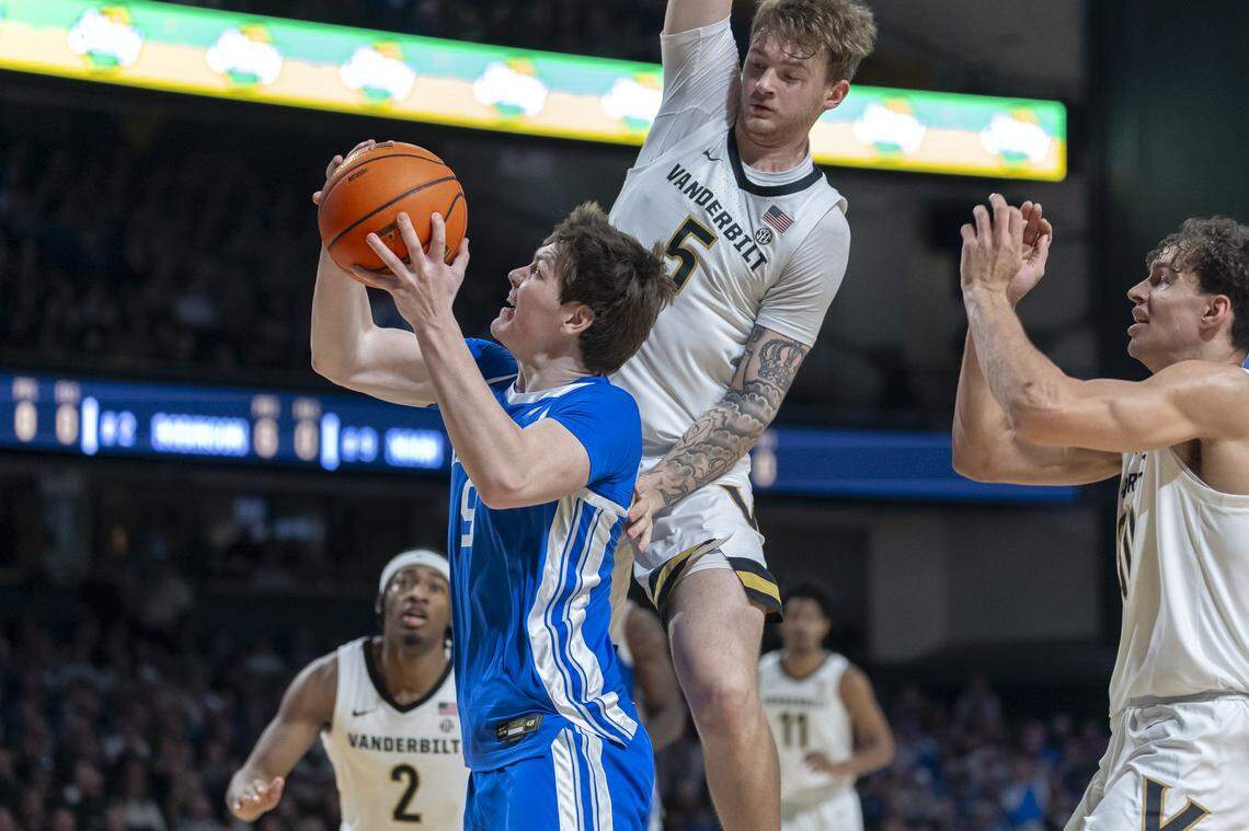 Kentucky forward Trent Noah (9) shoots the ball as Vanderbilt guard Tyler Nickel (5) defends during Saturday’s game at Memorial Gymnasium in Nashville, Tennessee.