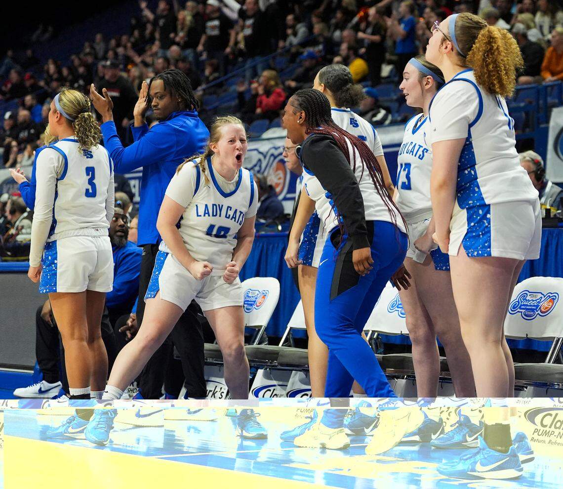 The Franklin-Simpson bench celebrates a bucket during the Clark’s Pump-N-Shop Girls’ Basketball Sweet 16 state tournament against Bullitt East at Rupp Arena on Thursday.