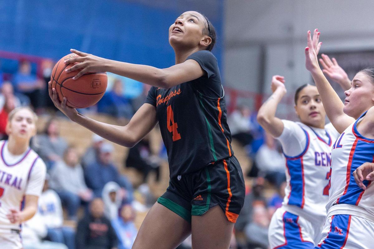Frederick Douglass’ Tamia Waide (4) shoots the ball in front of Madison Central’s Brooke Campbell (15) during their game at Madison Central High School in Richmond on Friday.