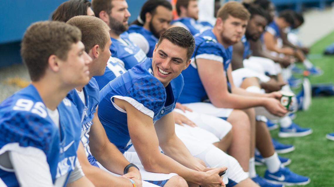 Kentucky punter Landon Foster, who talked with teammates during Kentucky's media day on Aug. 7, 2015, announced he is gay on Outsports.com on Wednesday.