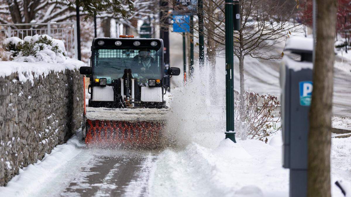 A plow cleared snow off of sidewalks next to UK’s dorms along South Limestone during UK’s move-In day Friday morning, January 7, 2022. Lexington had its first winter storm the previous day, resulting in several inches of snow blanketing the city.