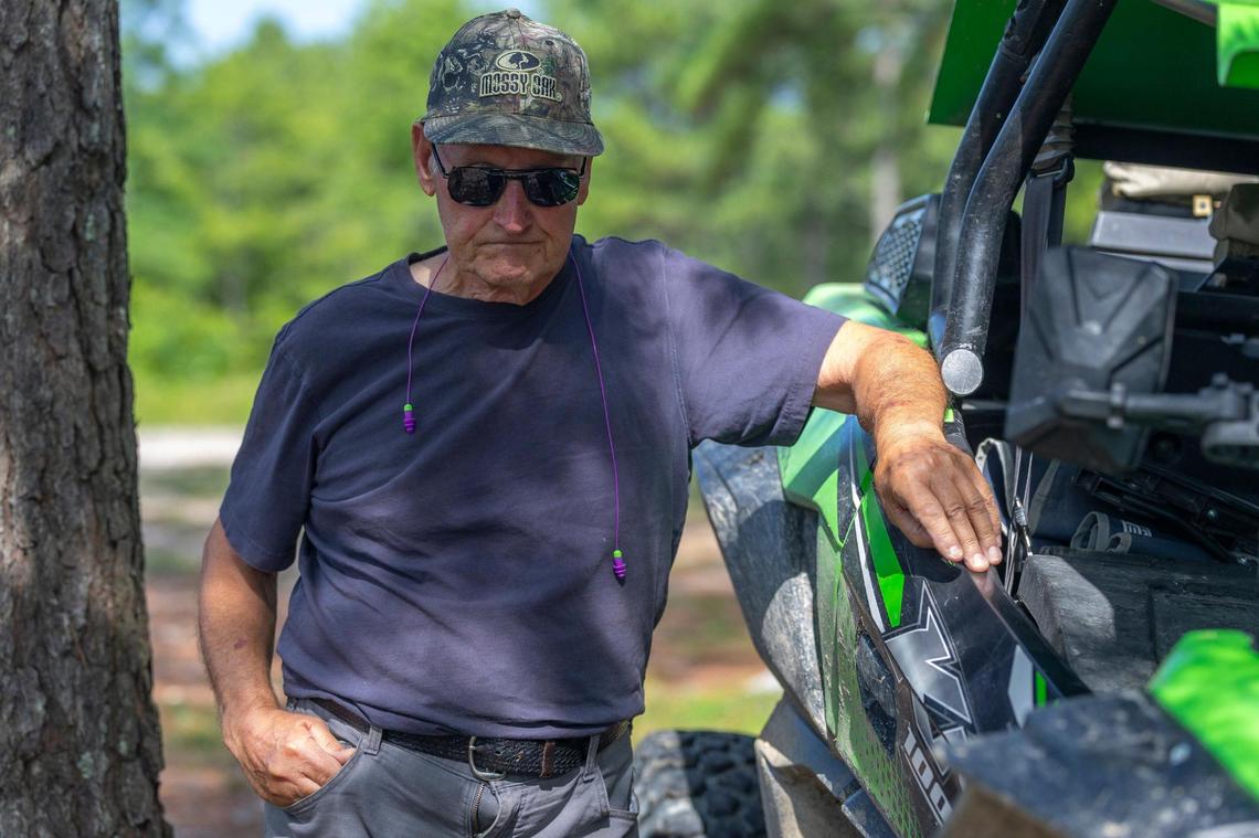 Lin Jones of Chicago is photographed in an area where wild horses roam near a former surface mine in Breathitt County, Ky., on Friday, July 11, 2025. ““We enjoy coming down and the horses are the big draw,” he said. “We don’t have a lot and what we’ve got we need to take care of.”