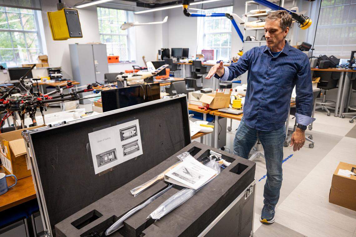 Sean Bailey, UK mechanical and aerospace engineering professor, explains in which direction the drones capture data on Monday, July 14, 2025, at the University of Kentucky campus in Lexington, Ky.