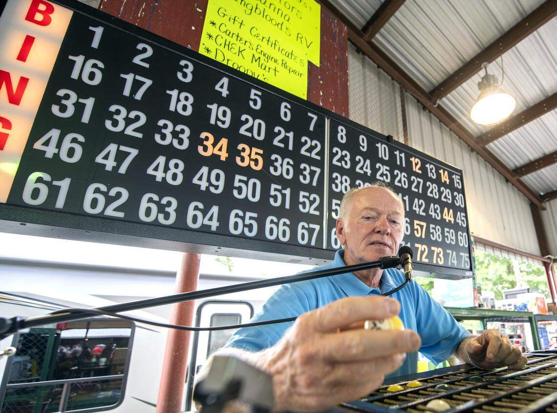 Sam Higdon, the long-time Bingo caller at the Fancy farm Picnic, calls out a number during the Fancy Farm Annual Fundraising Picnic in Fancy Farm, Ky., Saturday, Aug. 3, 2019.