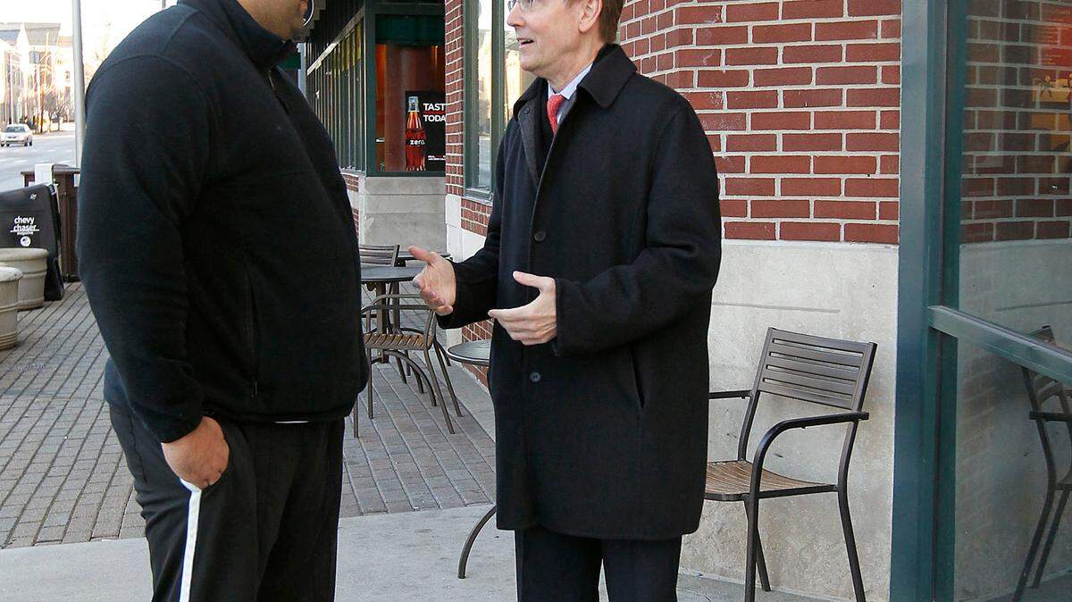 Rock Daniels, left, talked with Mayor Jim Gray before they entered the Starbucks at the corner of West Main and North Broadway in Lexington, Ky., Friday, January, 06, 2012. Gray is a regular customer at this Starbucks in the mornings. Gray said he often runs into people while at Starbucks as he did this morning with Daniels whom he walked with from Short St. Charles Bertram | Staff