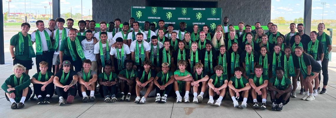 Members of Lexington Sporting Club’s pro men’s and women’s teams, along with youth players, pose for a photo following a press conference announcing that the LSC men’s team would be moving up to the USL Championship on Tuesday at the Lexington Sporting Club Pavilion.