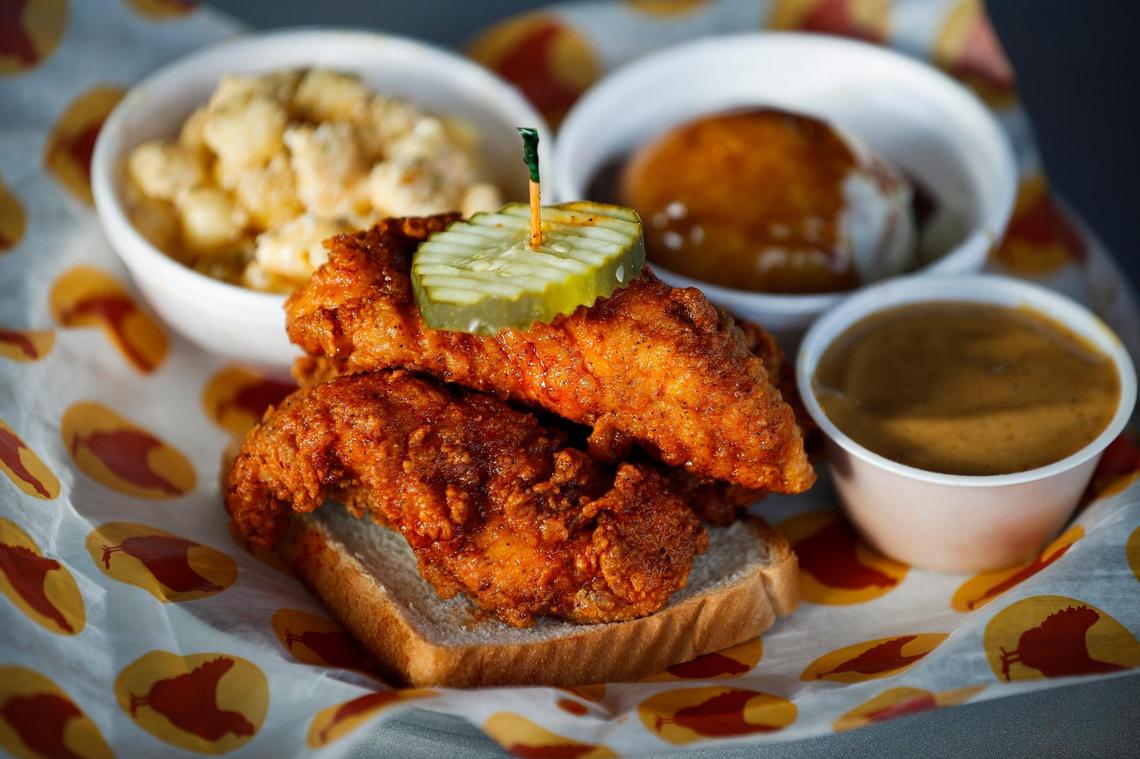 The jumbo tenders meal served with macaroni and cheese, mashed potatoes and side of JoJo sauce at Joella’s Hot Chicken at 2305 Sir Barton Way in Lexington Nov. 20 2020. 
