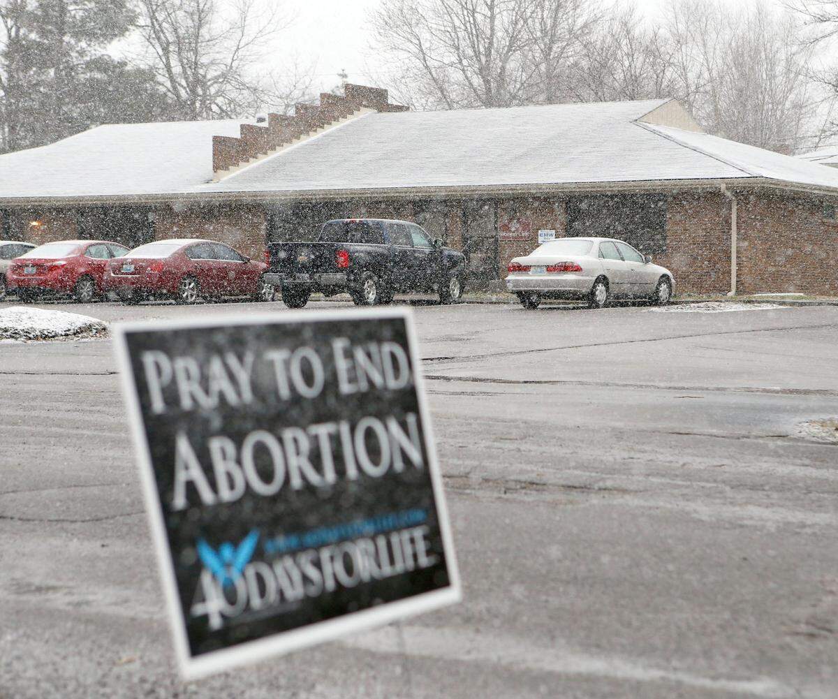 Sign across the street from the EMW Women’s Clinic, 161 Burt Rd. in Lexington, Ky., Thursday, March 3, 2016. The administration of Gov. Matt Bevin claims in a lawsuit filed Wednesday in Fayette Circuit Court that says Eubanks & Marshall of Lexington, PSC, doing business as EMW Women’s Clinic, is operating an unlicensed abortion clinic at 161 Burt Road, off Nicholasville Road.