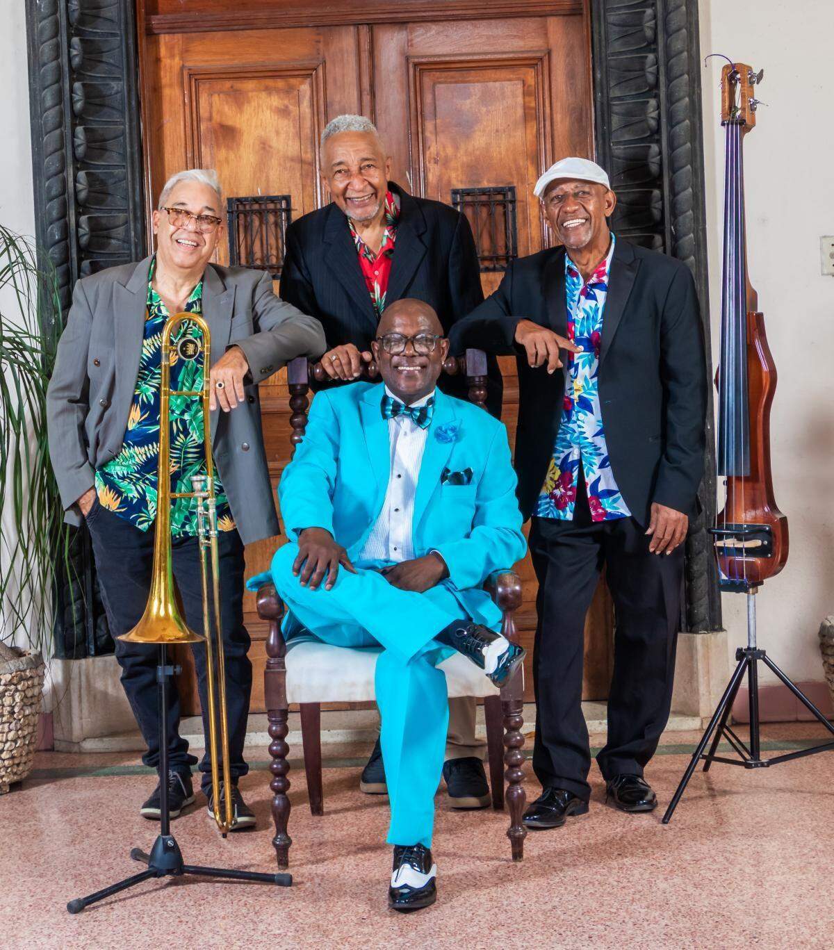 Bueva Vista Social Orchestra, including from left, standing, Emilio Senon Morales Ruiz, Fabian Garcia and Luis “Betun” Mariano Valiente Marin. Seated in front is Jesus “Aguaje” Ramos.