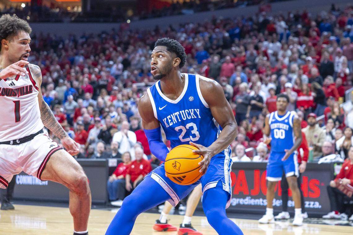 Kentucky forward Mouhamed Dioubate (23) looks to shoot the ball as Louisville guard J'Vonne Hadley (1) defends during Tuesday’s game at the KFC Yum Center in Louisville.