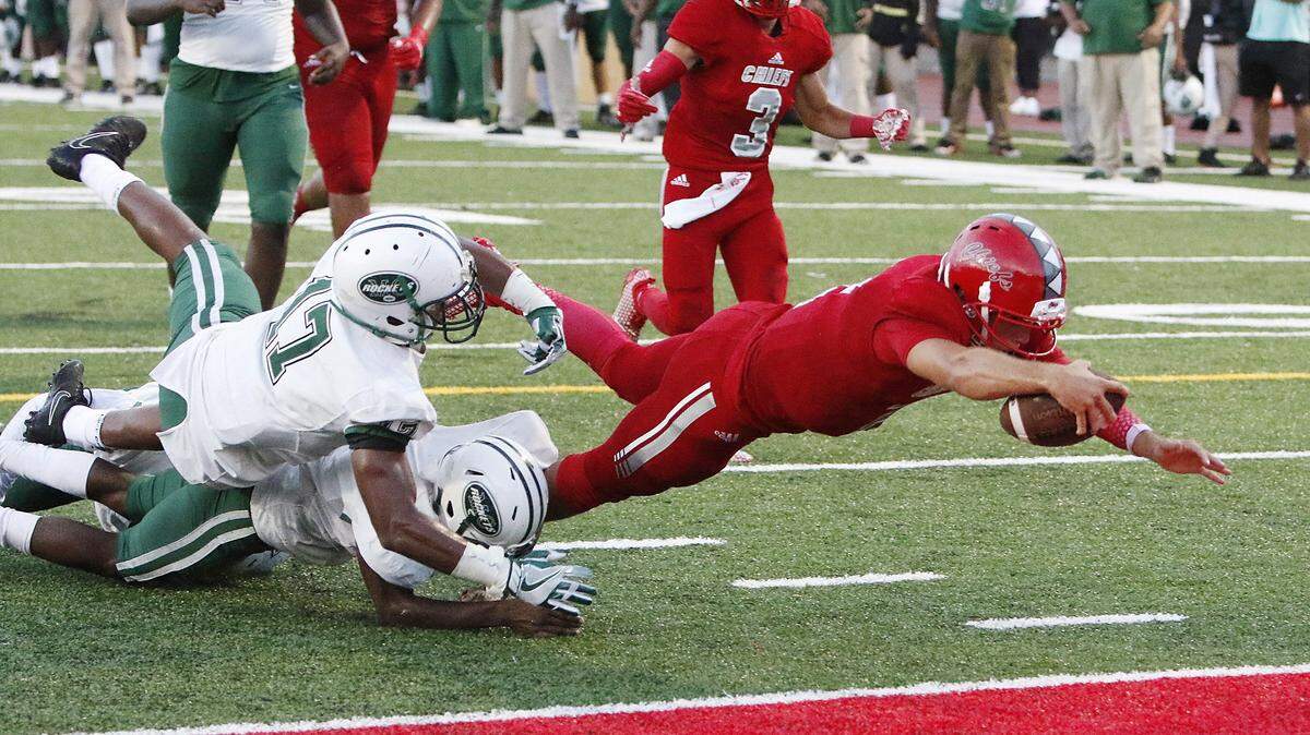 Nik Scalzo dove for a touchdown during a game this fall in Fort Lauderdale, Fla.  The quarterback, who has committed to play at UK, tore an ACL last Friday.
