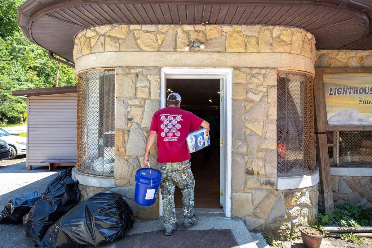 Donated items are unloaded at Lighthouse Baptist Church in Knott County, Ky., for distribution to flood victims on Wednesday, Aug. 3, 2022.