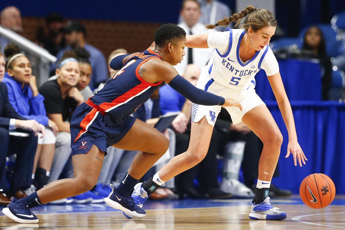 Kentucky guard Blair Green (5) stole the ball from Virginia’s Dominique Toussaint (4) during their game Thursday at Rupp Arena in Lexington.
