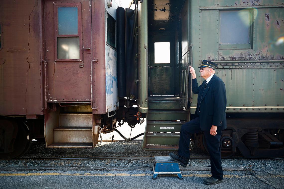 Asst. conductor Jeff Hedge, of Georgetown waits for passengers Friday before Kentucky Railway Museum Heritage Highball Excursion. The tour will make a stop in Lexington on Saturday.